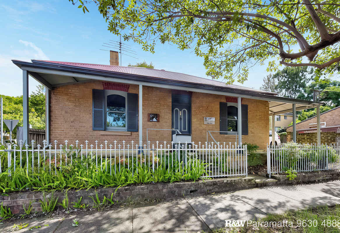 A rare historical commercial cottage - timeless charm, modern comforts & prime corner location 